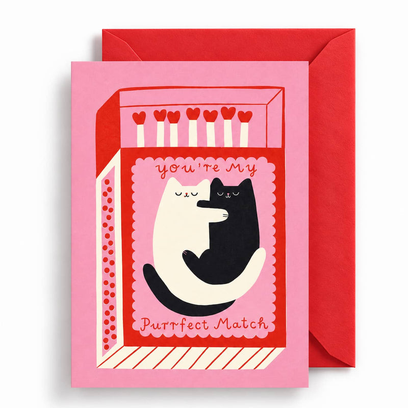 Purrfect Match Greeting Card - Purrfect Match greeting card featuring two cuddling black and cream cats inside a playful pink and red matchbox design, with the message “You’re My Purrfect Match” and a red envelope.