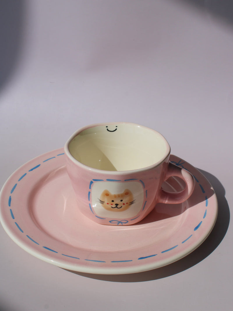 Mimi Ceramic Mug paired with matching Mimi Ceramic Plate, pink cat-themed handmade ceramic set