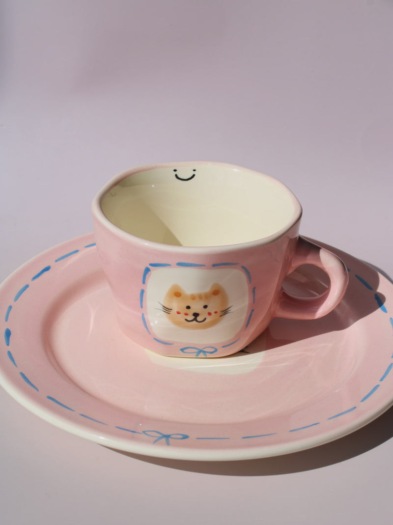 Mimi Ceramic Mug paired with matching Mimi Ceramic Plate, pink cat-themed handmade ceramic set