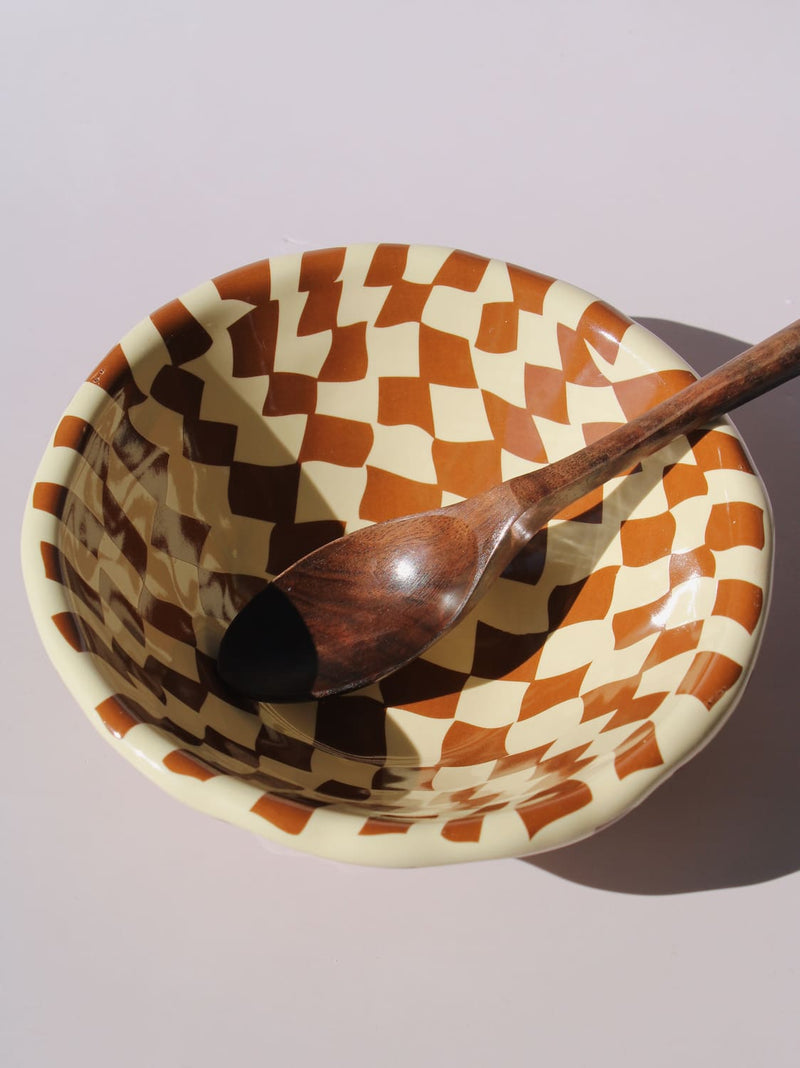 Nova Ceramic Bowl with brown and cream checkered pattern, styled with a green checkered spoon, handmade ceramic bowl top view