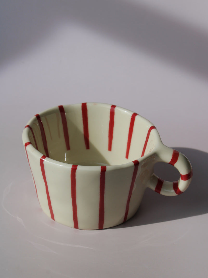 Arlo Ceramic Mug with bold red vertical stripes on a cream base, handmade pottery coffee mug with curved handle