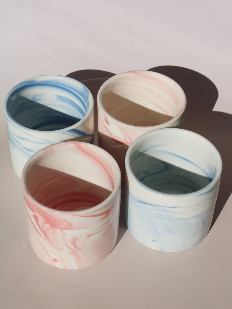 Blush and Sumi ceramic cups with pink and blue marble swirl glazes, handmade stoneware cups styled together.
