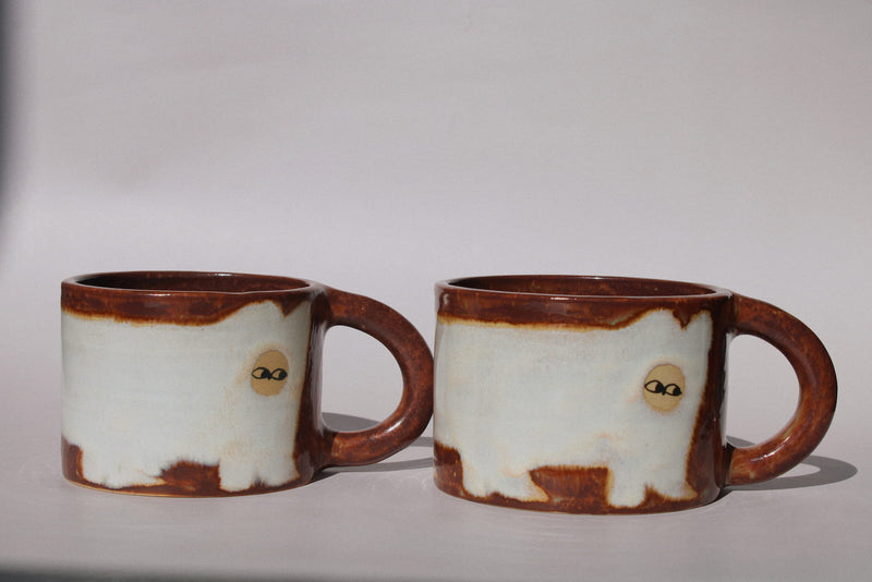 Chestnut Ceramic Cat Mug by Marta Shurpakova – handmade brown and cream ceramic mug with a playful cat design