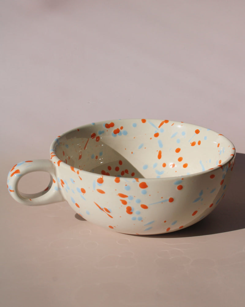 Naro ceramic bowl with blue and orange speckled glaze, handmade soup bowl with handle for everyday dining.