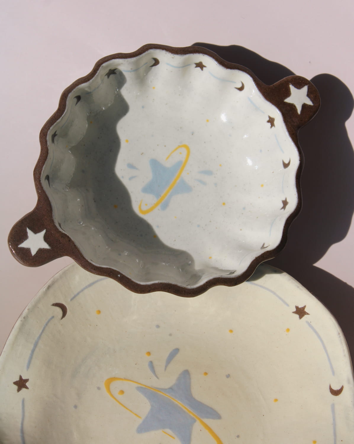 Elio ceramic small plate paired with Nebula sauce dish, handmade celestial tableware with star and moon details.