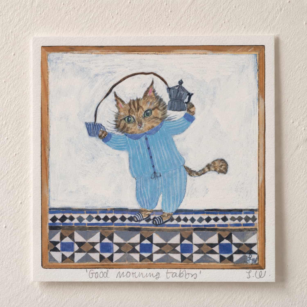 Good Morning Tabby Art Print featuring a tabby cat in blue striped pajamas holding a moka pot and coffee cup, set against a hand-painted blue and cream patterned background.