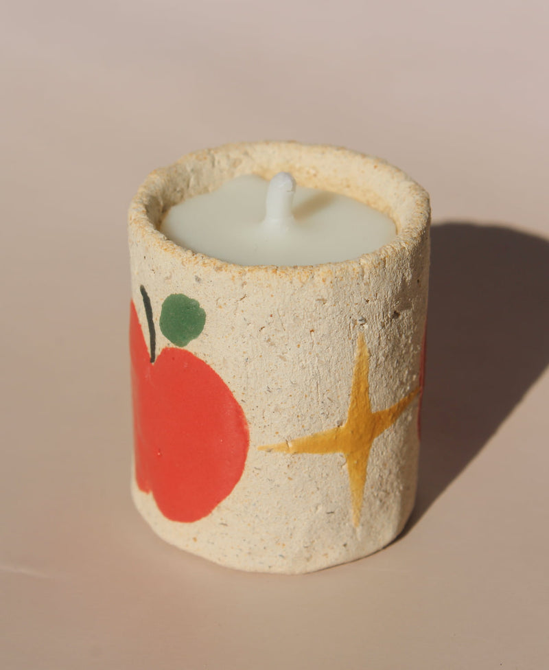 Pomelle mini scented candle in handmade ceramic holder with red apple motif, cute decorative candle for cozy home decor.