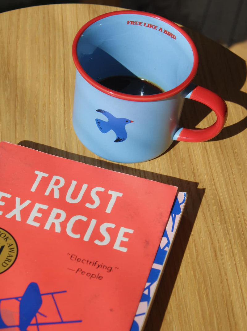 Birdie ceramic mug styled with book, cozy coffee moment with handmade ceramic cup