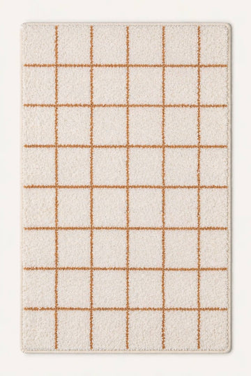 Grid-patterned rug with beige lines on a white background