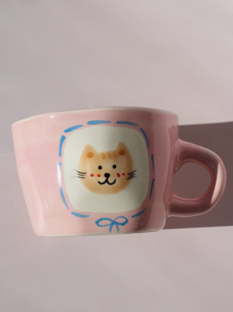 Mimi Ceramic Mug in pink with hand-painted cat face and smiley face inside, handmade ceramic coffee mug
