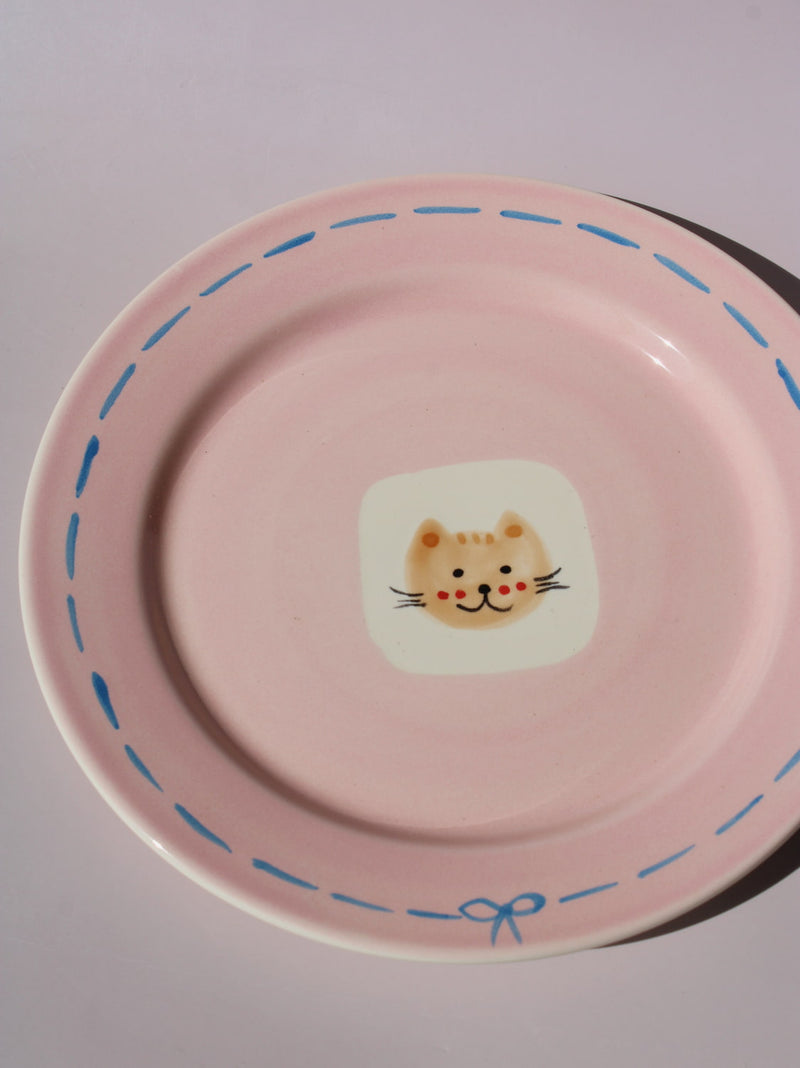 Mimi Ceramic Plate in pink with hand-painted cat face and blue dashed border, handmade ceramic dessert plate