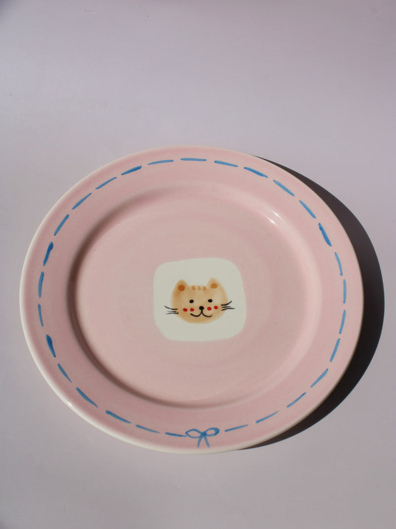 Mimi Ceramic Plate in pink with hand-painted cat face and blue dashed border, handmade ceramic dessert plate
