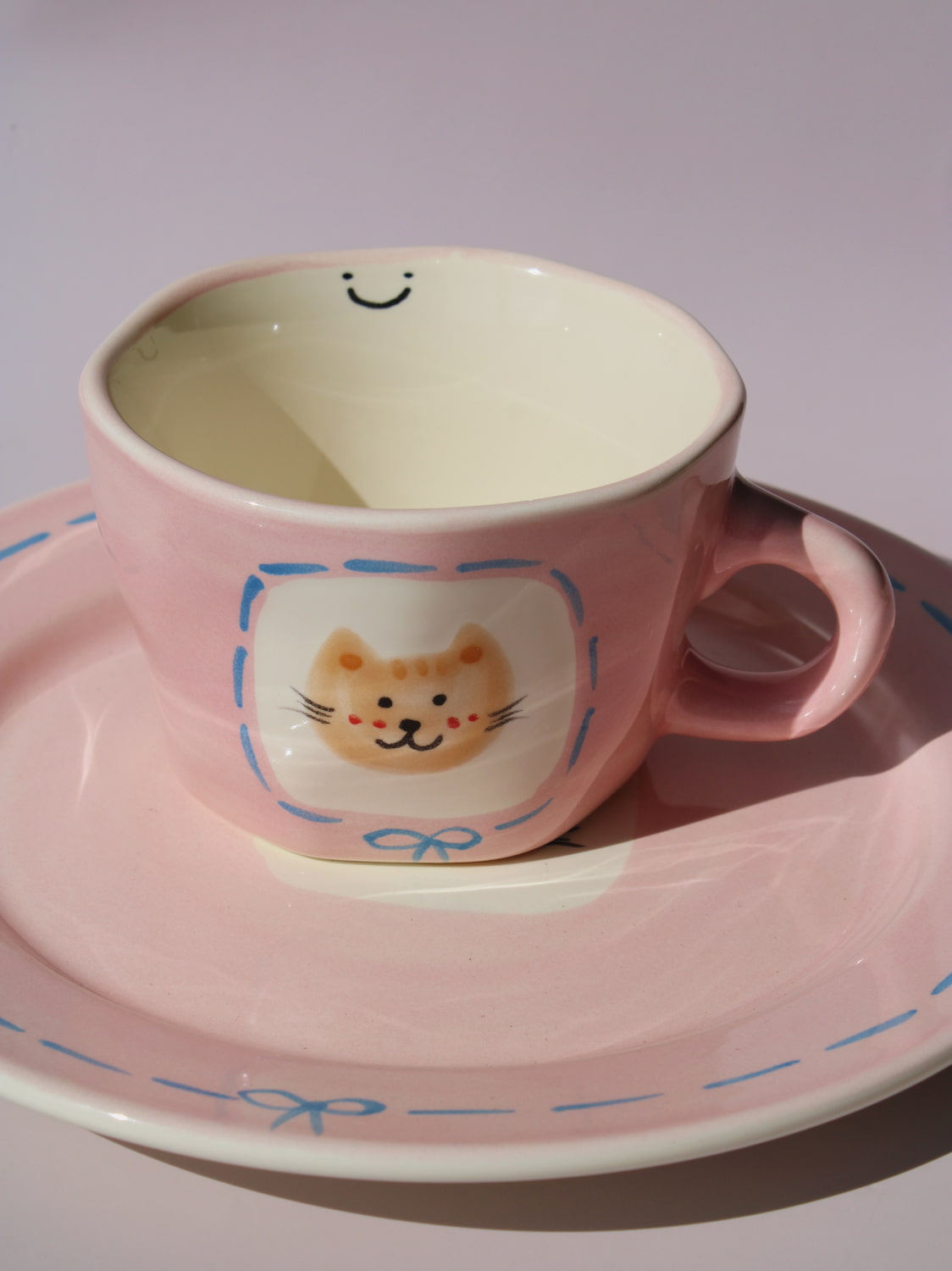 Mimi Ceramic Mug paired with matching Mimi Ceramic Plate, pink cat-themed handmade ceramic set
