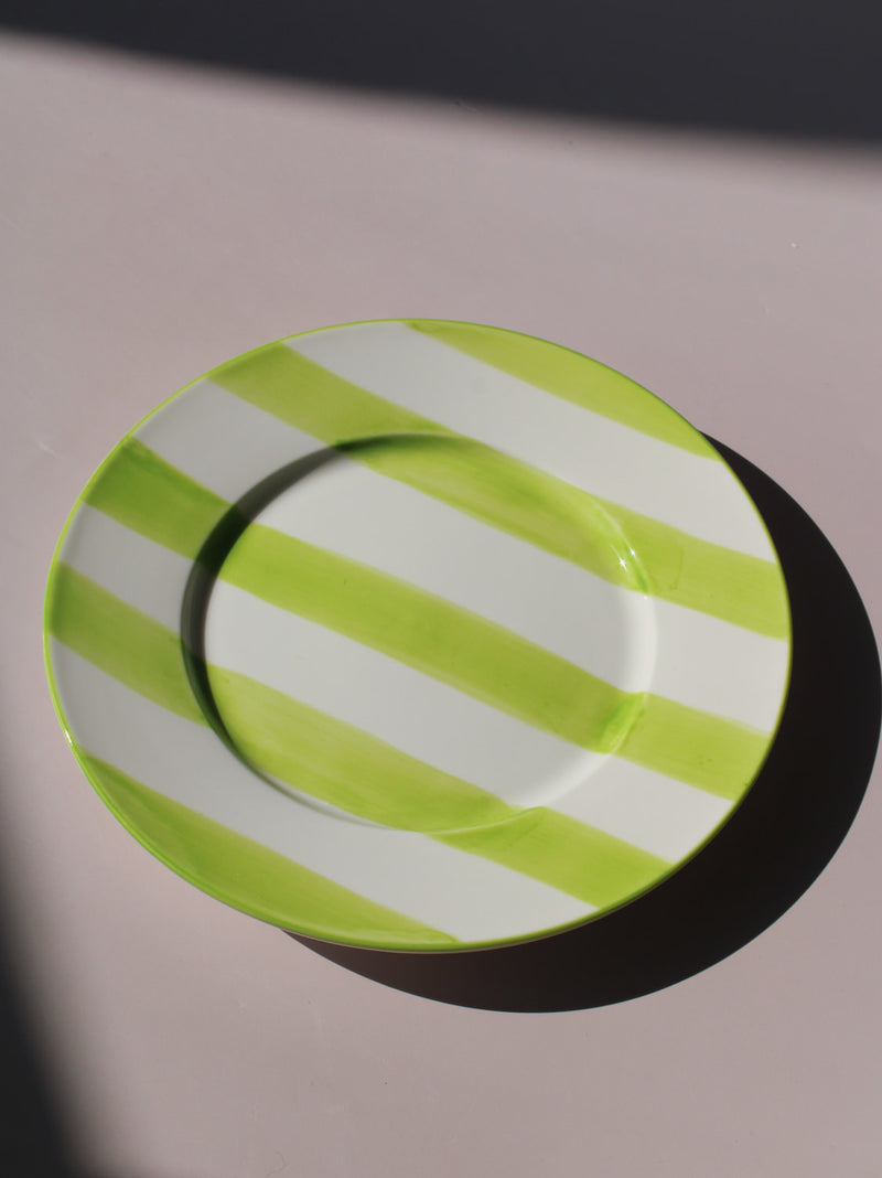 Olia Plate with bold green and white stripes, styled with a wooden fork, handmade ceramic plate top view