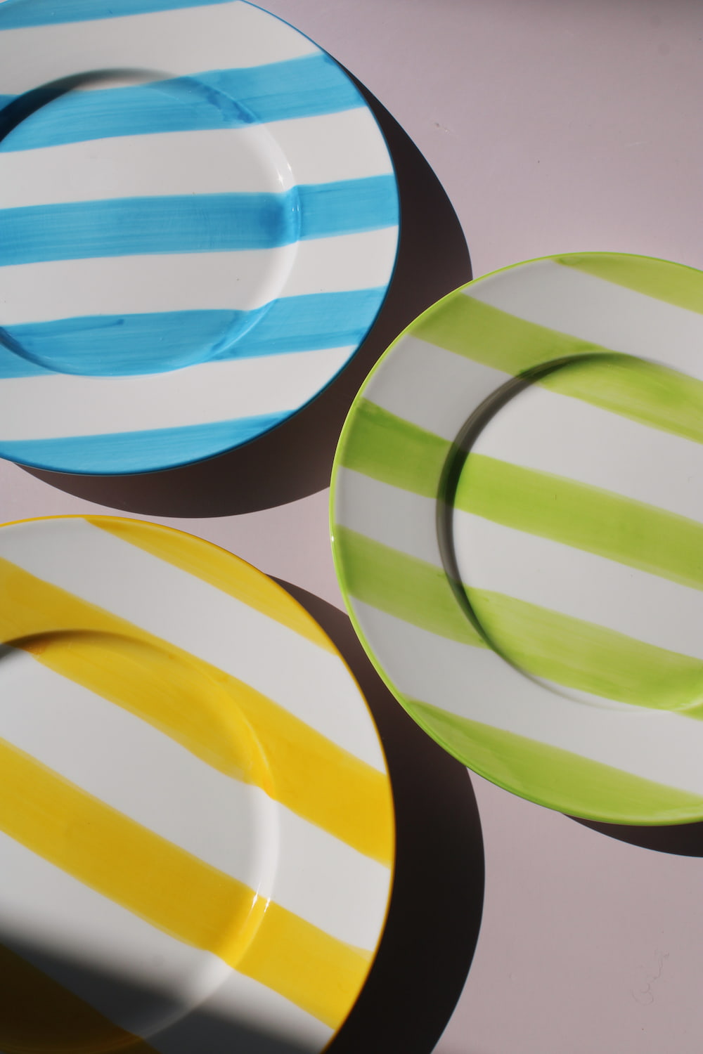 Etta, Olia and Mirel Plates together, handmade ceramic plates in yellow, green and blue stripes
