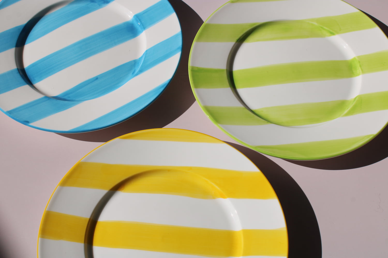 Etta, Olia and Mirel Plates together, handmade ceramic plates in yellow, green and blue stripes