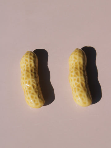Peanut Ceramic Chopstick Rest Set shaped like peanut shells, styled with wooden chopsticks, handmade ceramic