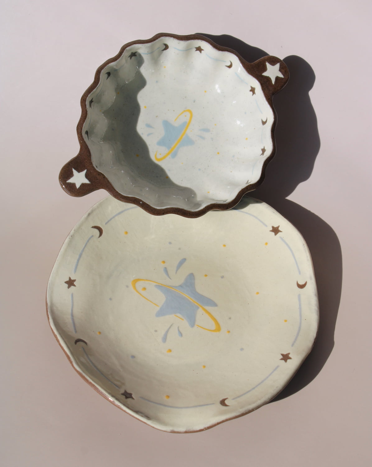 Elio ceramic small plate paired with Nebula sauce dish, handmade celestial tableware with star and moon details.