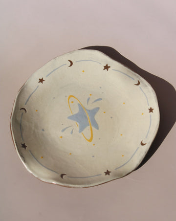 Elio handmade ceramic small plate with celestial star and moon motif, artisan tableware for desserts or small bites.