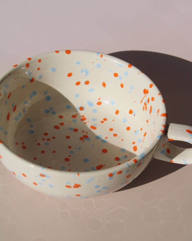 Naro ceramic bowl with blue and orange speckled glaze, handmade soup bowl with handle for everyday dining.