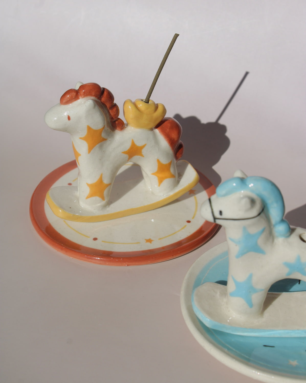 Ponyo ceramic horse incense holder with yellow stars and warm terracotta accents, whimsical ceramic incense burner with star tray.