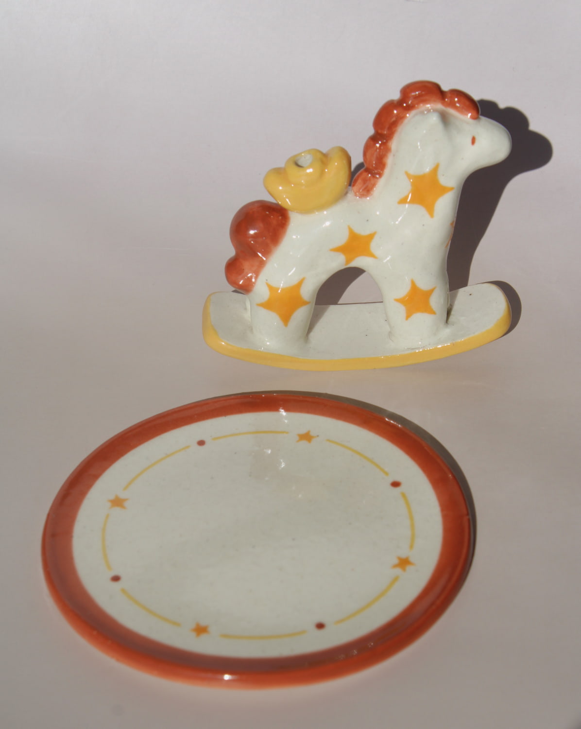 Ponyo ceramic horse incense holder with yellow stars and warm terracotta accents, whimsical ceramic incense burner with star tray.