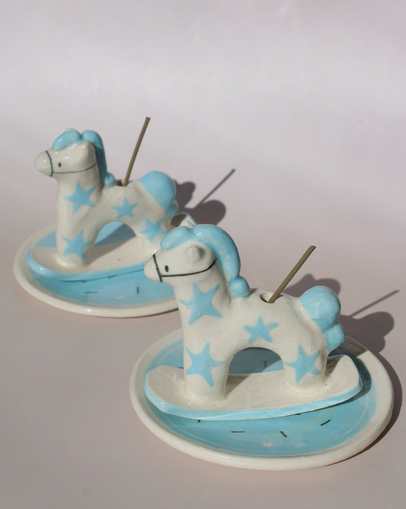 Two Ponette ceramic horse incense holders with blue stars and matching trays, playful ceramic incense burners for home decor.