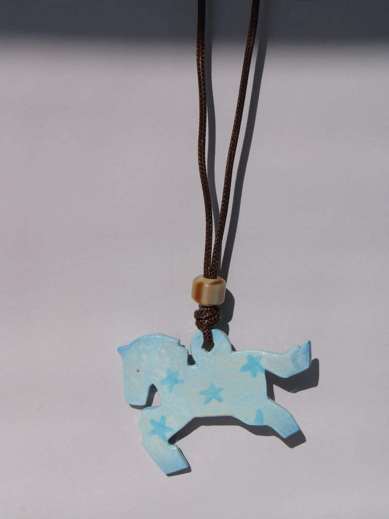 Pony Charm Necklace in Stardust Pony design, light blue ceramic horse pendant with star pattern on brown cord