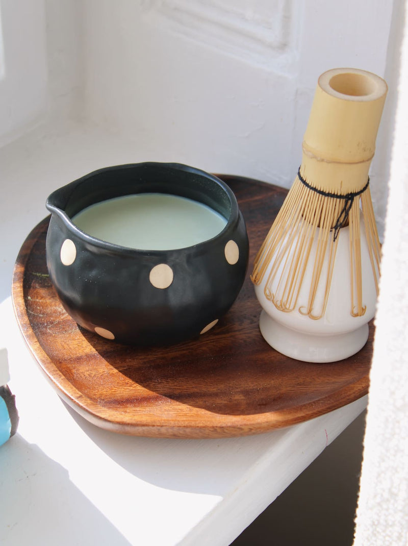 Ceramic mochi matcha bowl paired with chasen whisk and tea ritual setting
