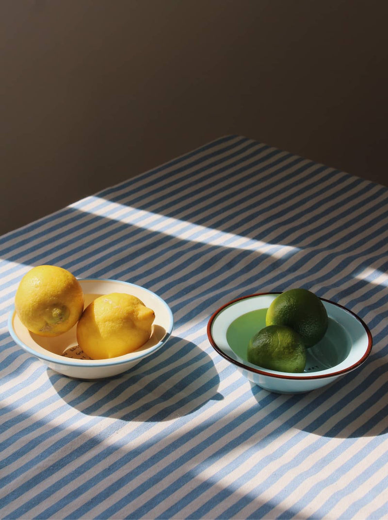 Blue base Cielo ceramic bowl styled with fruit, handmade bowl for modern tableware