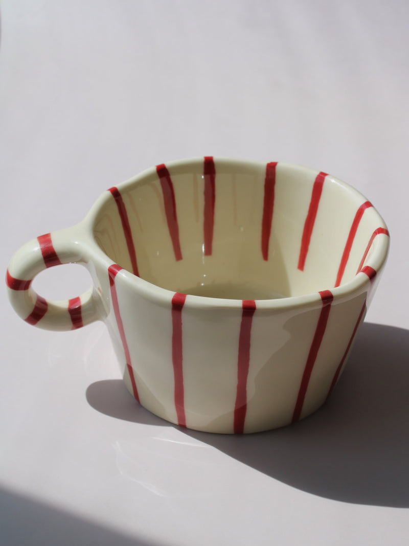 Arlo Ceramic Mug with bold red vertical stripes on a cream base, handmade pottery coffee mug with curved handle