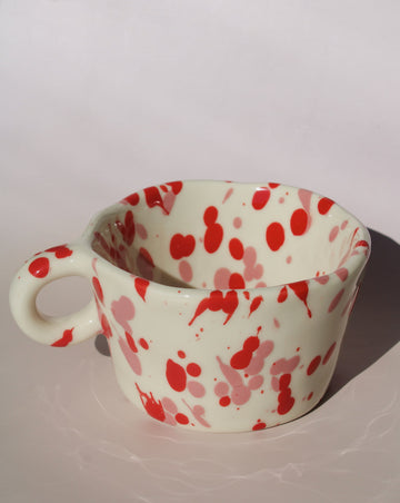 Red splatter ceramic espresso cup with rounded handle, handmade speckled coffee cup.
