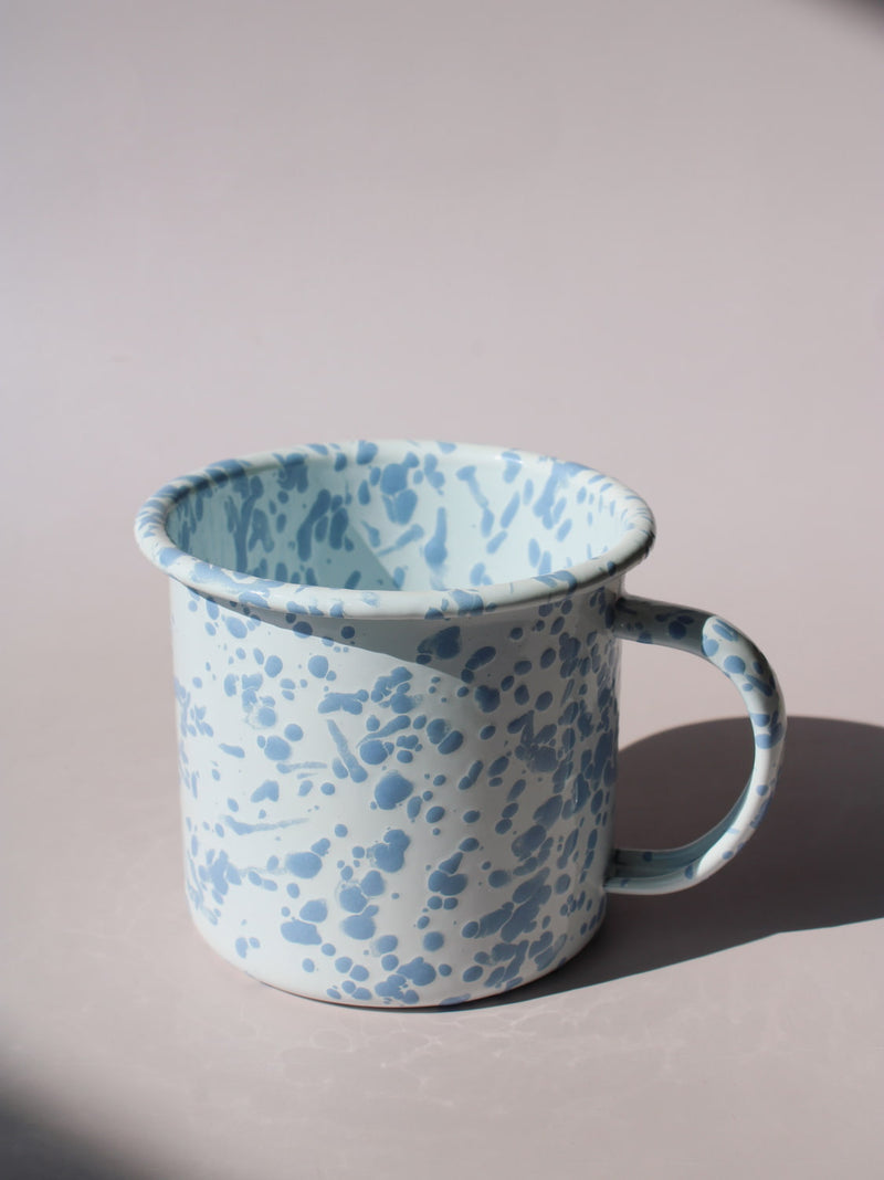 Aeris Enamel Mug in speckled baby blue, handmade enamel coffee mug top angle view