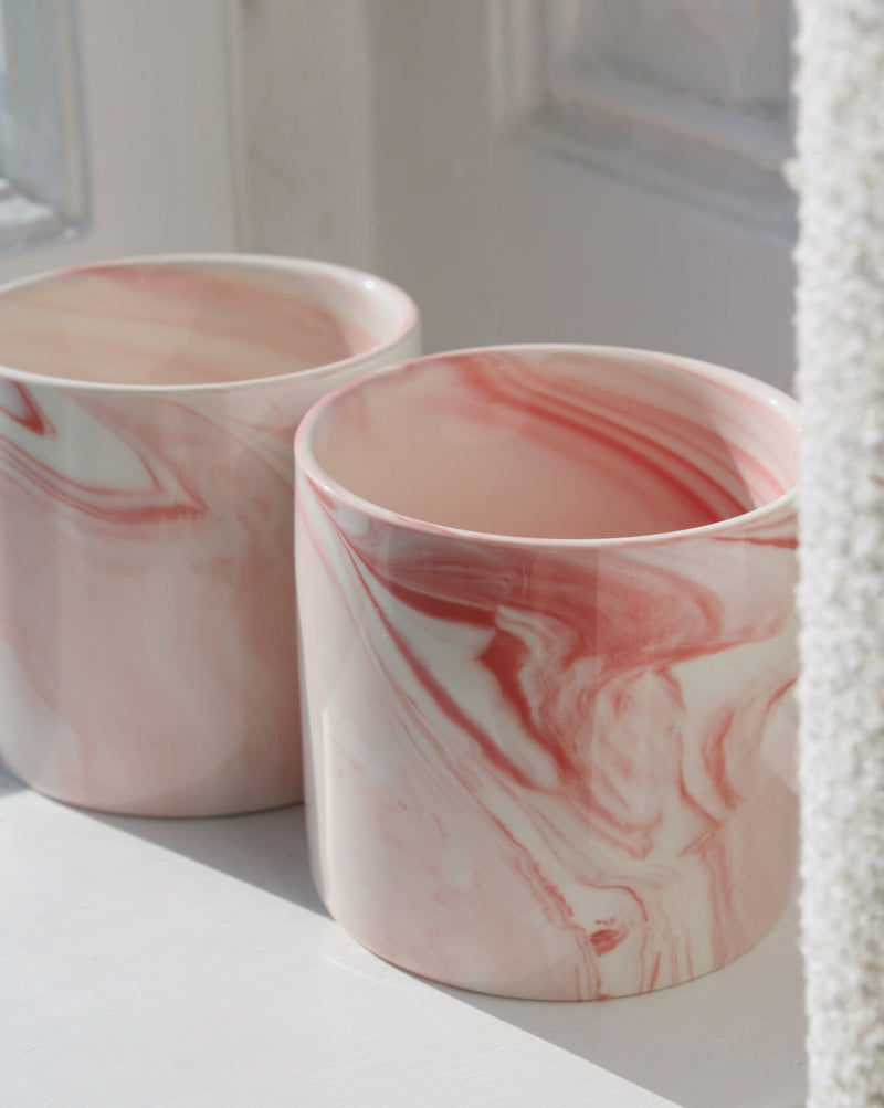 Two Blush ceramic cups with pink marble swirl glaze, handmade stoneware cups for modern tableware.