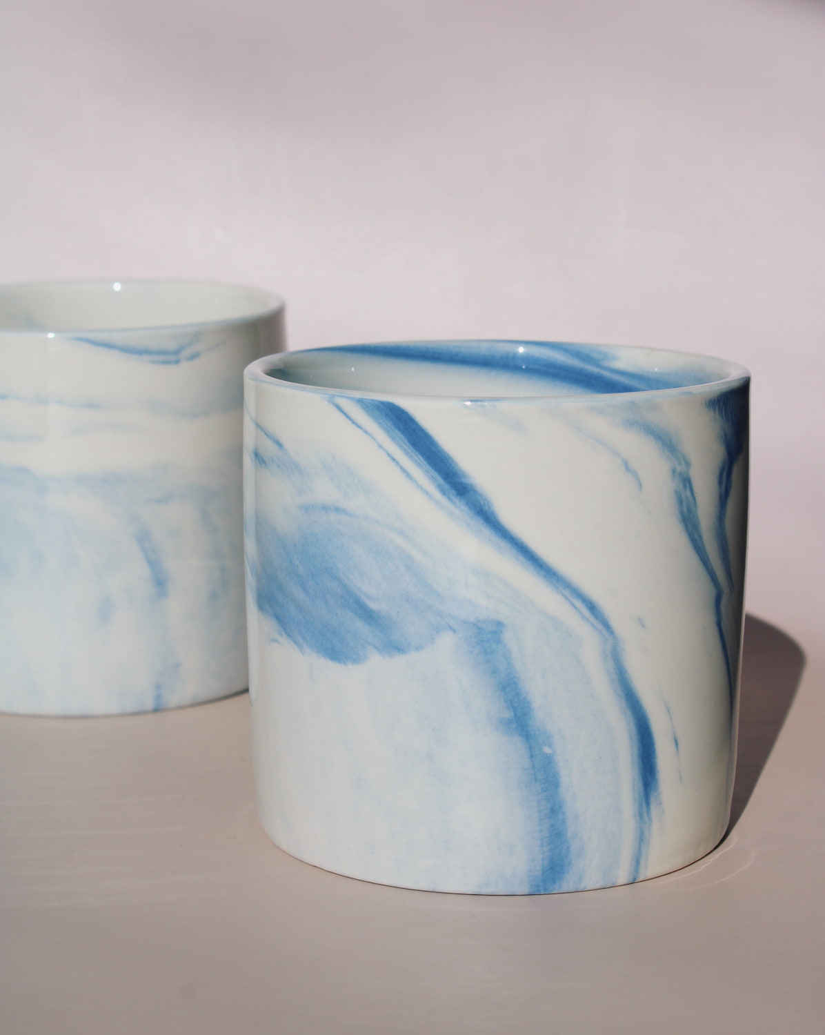 Two Sumi ceramic cups with blue marble swirl glaze, handmade stoneware cups for coffee or tea.