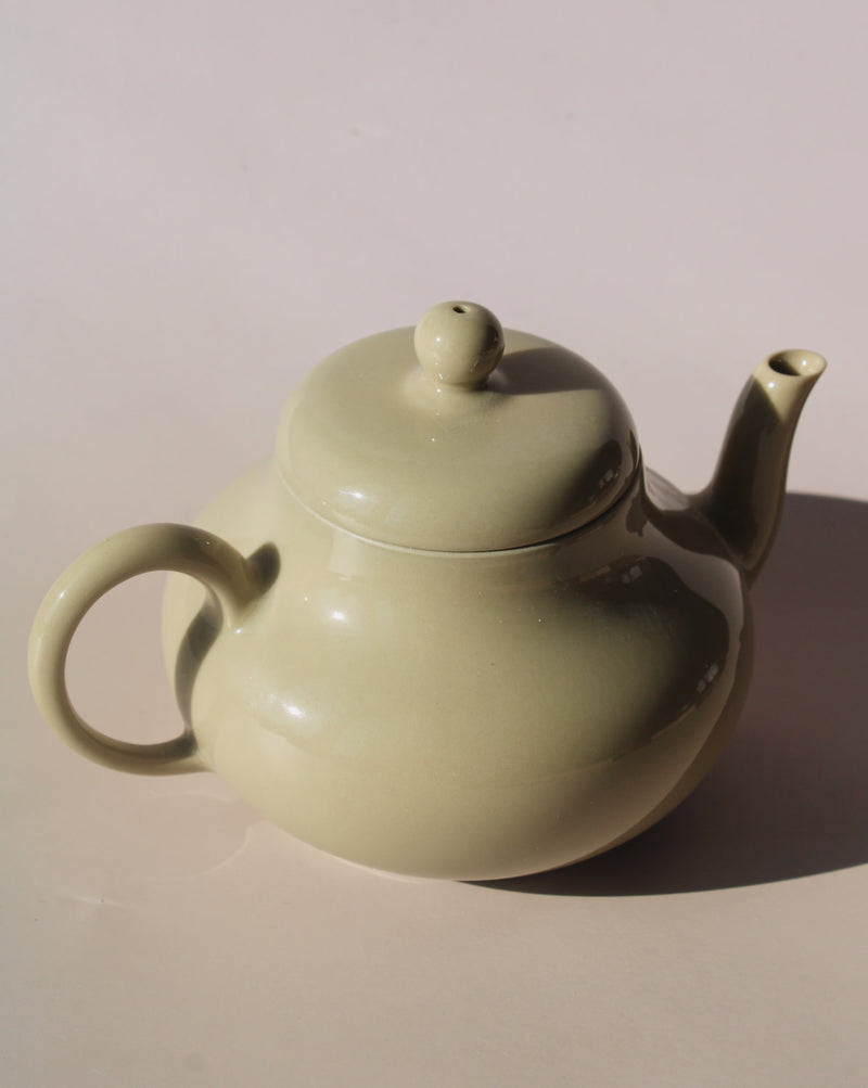 Sumi ceramic teapot in soft sage glaze with rounded shape and lid, minimalist handmade teapot for loose leaf tea.