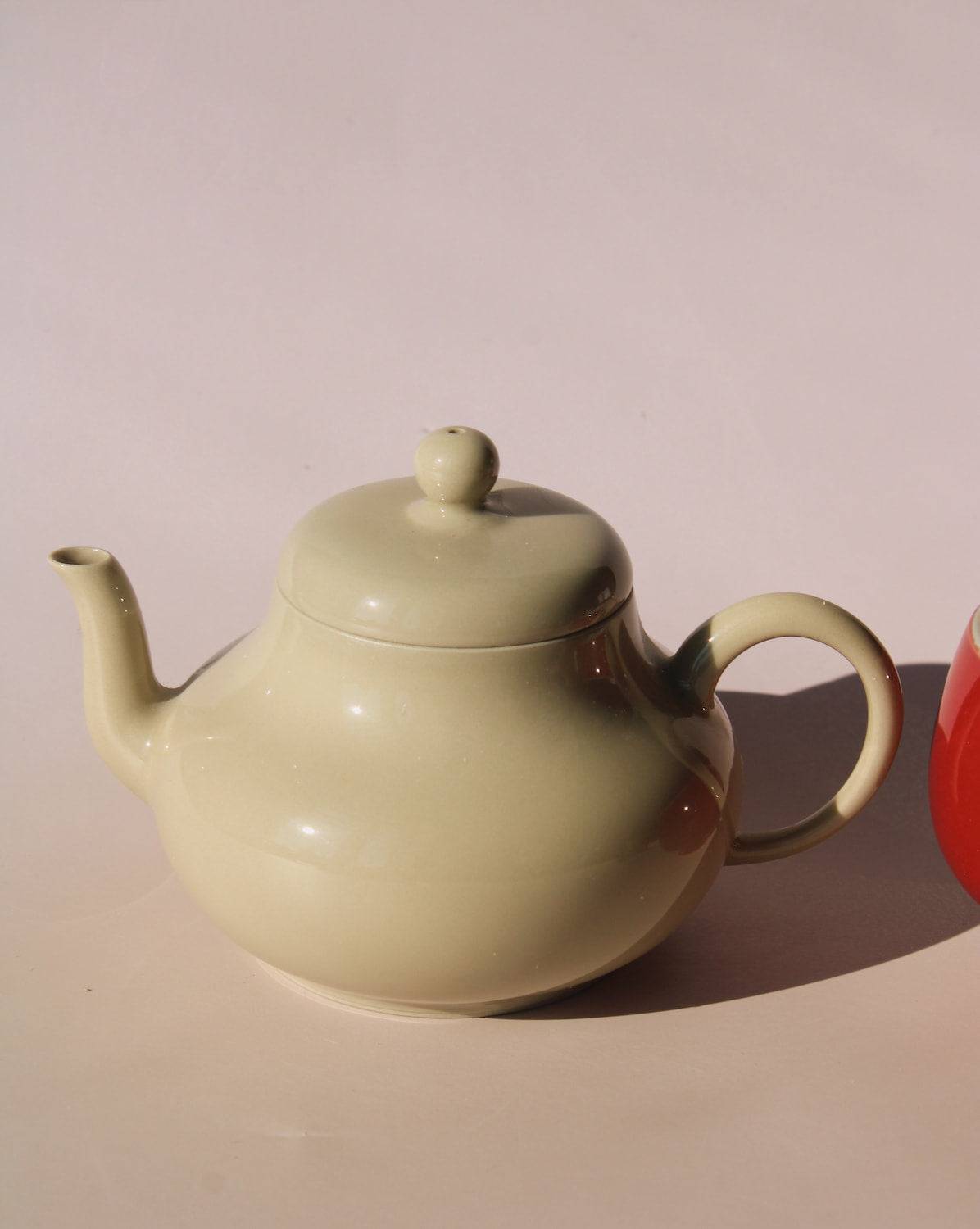 Sumi ceramic teapot in soft sage glaze with rounded shape and lid, minimalist handmade teapot for loose leaf tea.
