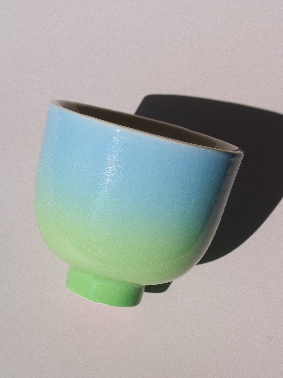 Sky Yunomi Cup against a pink background