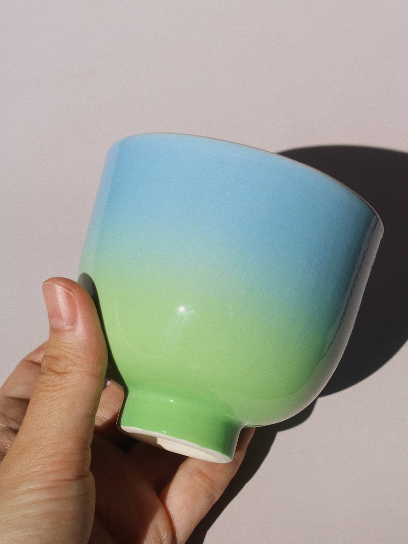 Sky Yunomi Cup against a pink background