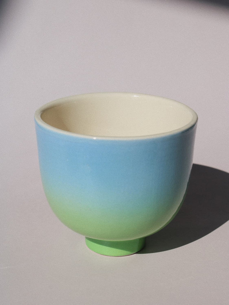 Sky Yunomi Cup against a pink background