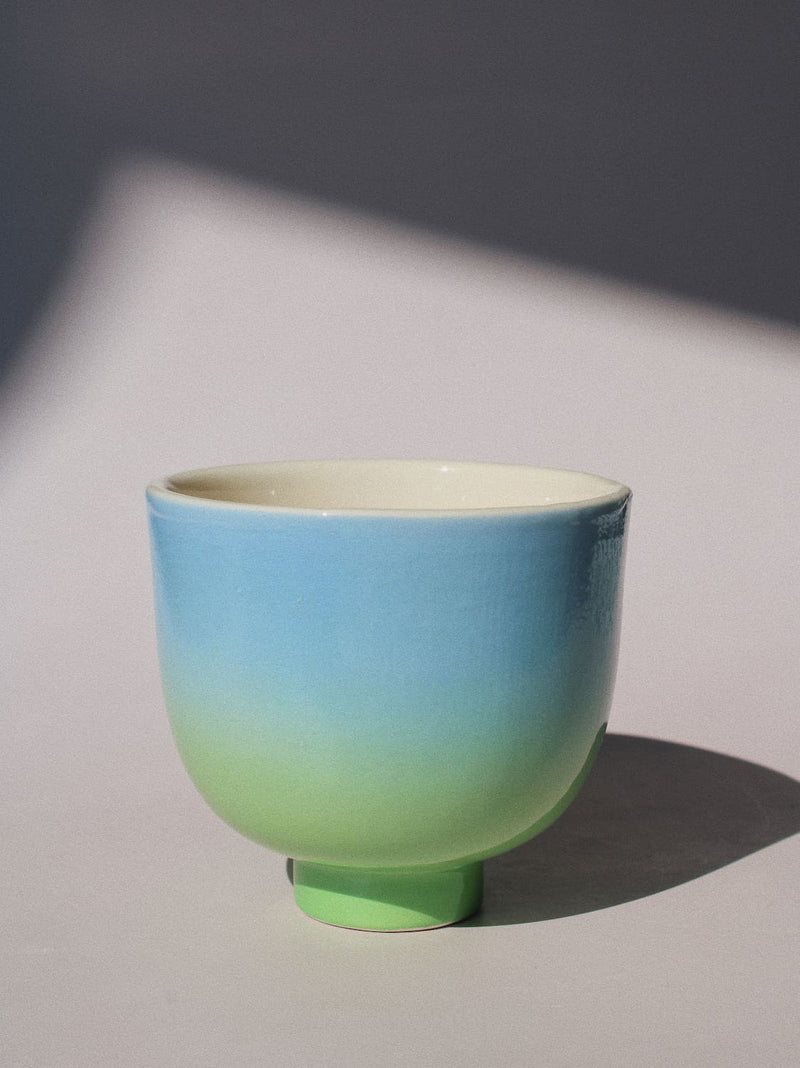 Sky Yunomi Cup against a pink background