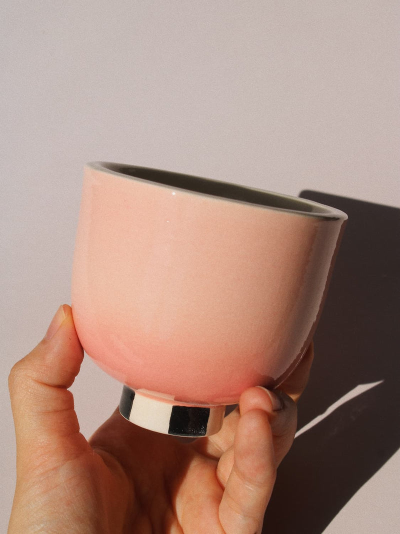 Sunset Yunomi Cup against a pink background