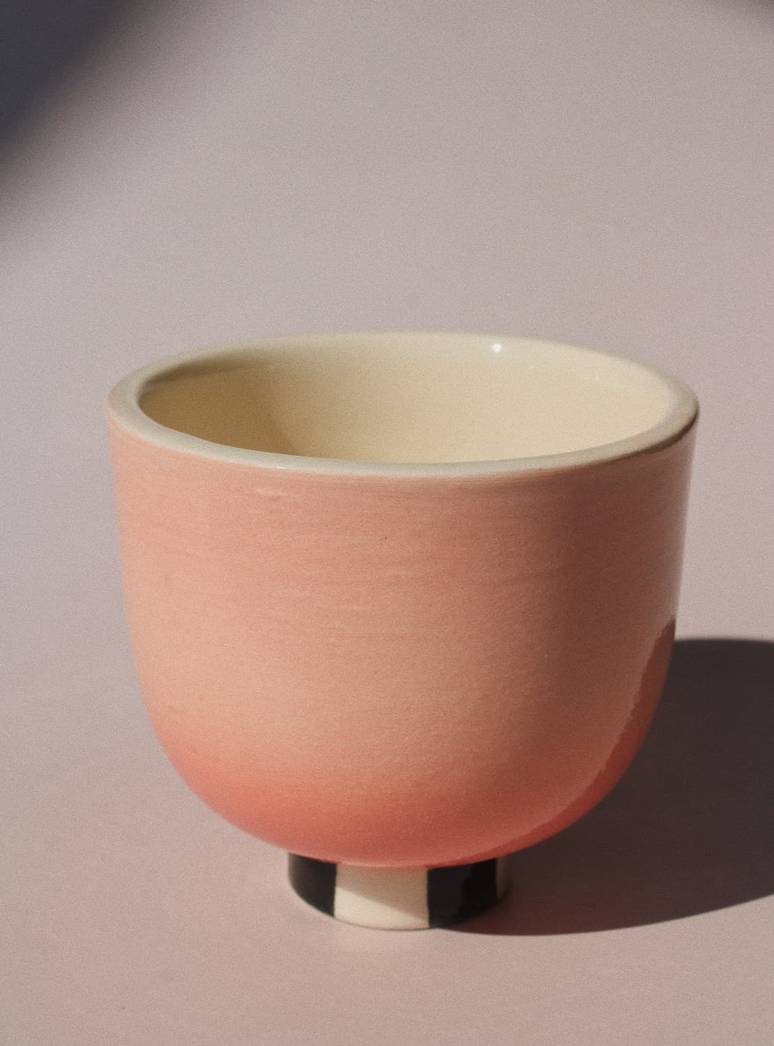 Sunset Yunomi Cup against a pink background