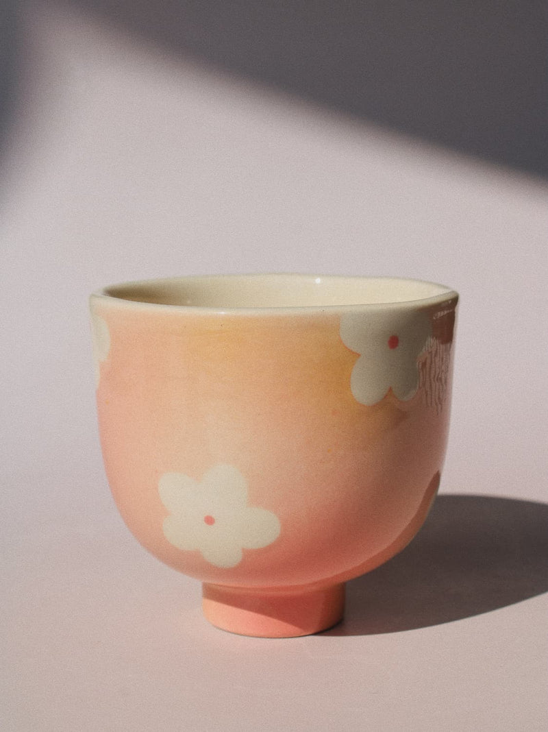 Garden Yunomi Cup against a pink background