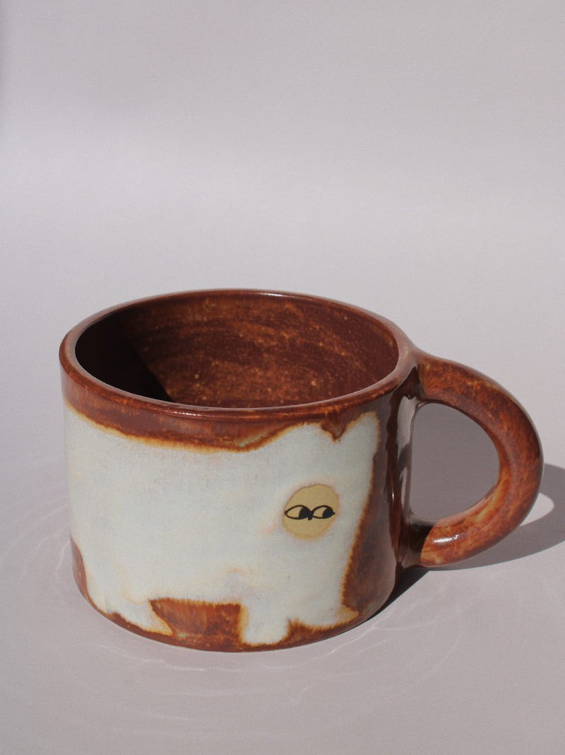Chestnut Ceramic Cat Mug by Marta Shurpakova – handmade brown and cream ceramic mug with a playful cat design