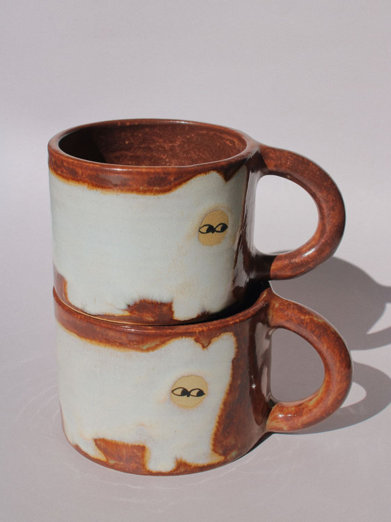 Chestnut Ceramic Cat Mug by Marta Shurpakova – handmade brown and cream ceramic mug with a playful cat design