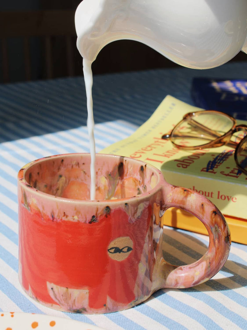 Poppy Ceramic Cat Mug by Marta Shurpakova – handmade ceramic mug with a playful cat design in a colourful home setting