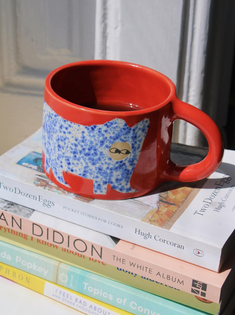 Scarlet Ceramic Cat Mug by Marta Shurpakova – handmade red ceramic mug with a playful cat design