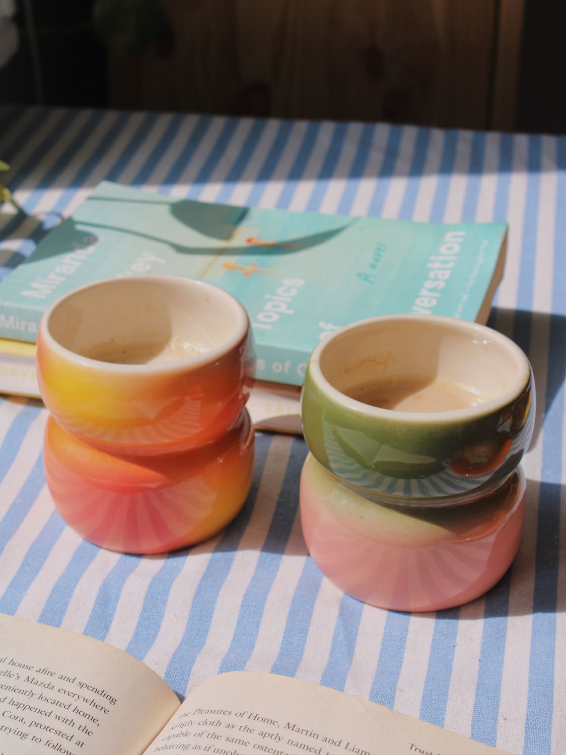 Belly Garden Ceramic Mug by Agata Puławska – colourful handmade ceramic mug styled with coffee 