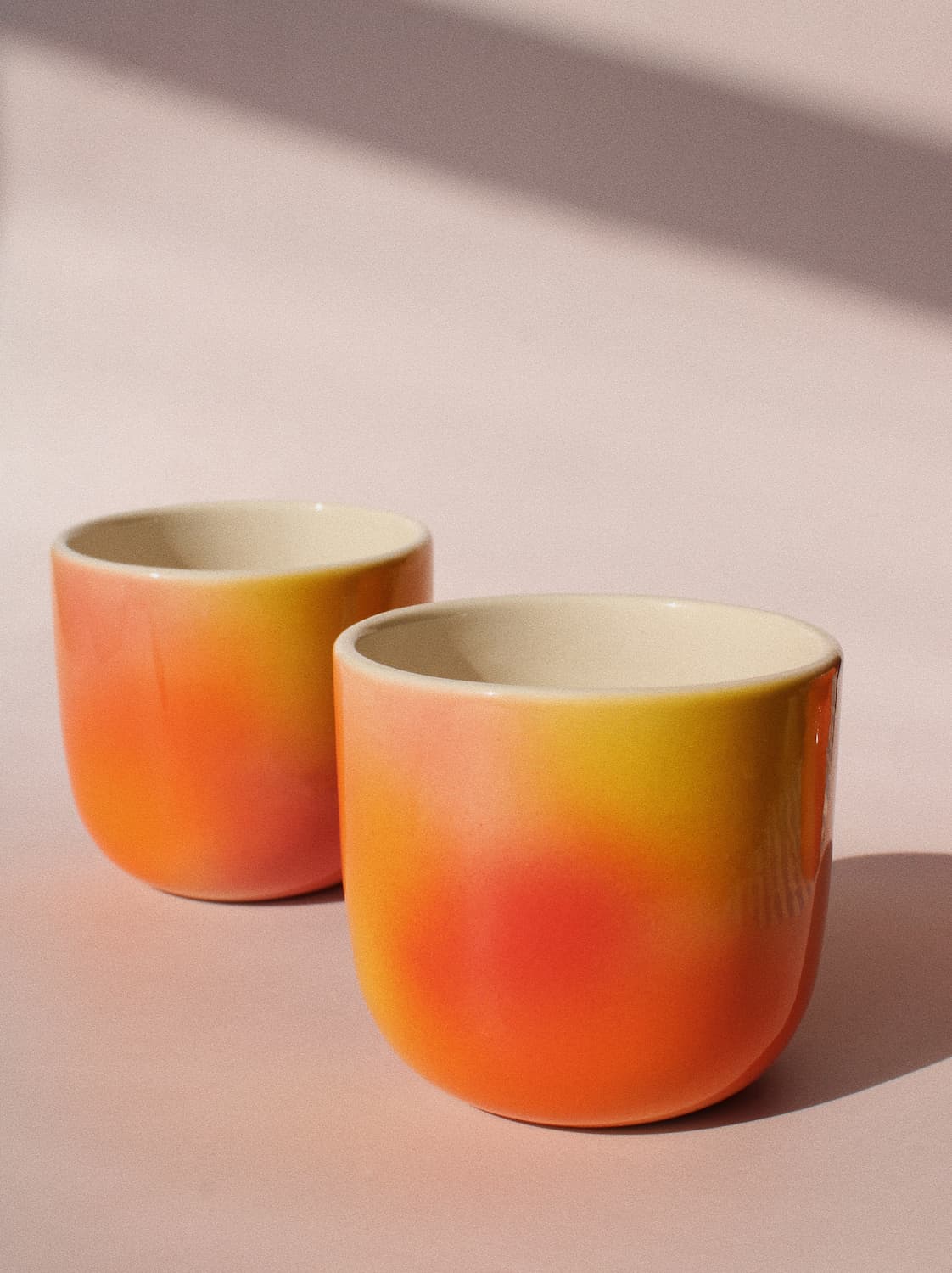 Sunset Gradient Ceramic Cup by Agata Puławska – handmade ceramic cup with a warm yellow, orange and coral gradient